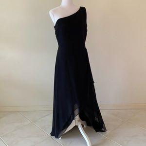 Beautiful black dress. Fully lined with side zipper. Elegantly layered skirt.